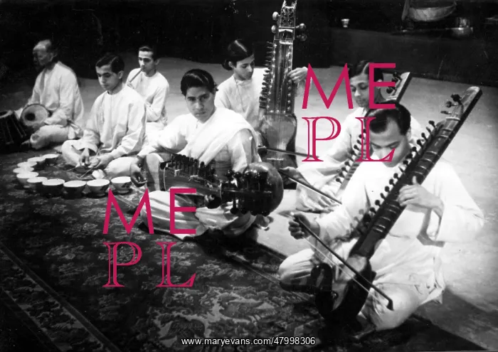 : An Indian music ensemble playing various musical instruments : An Indian music ensemble playing various musical instruments