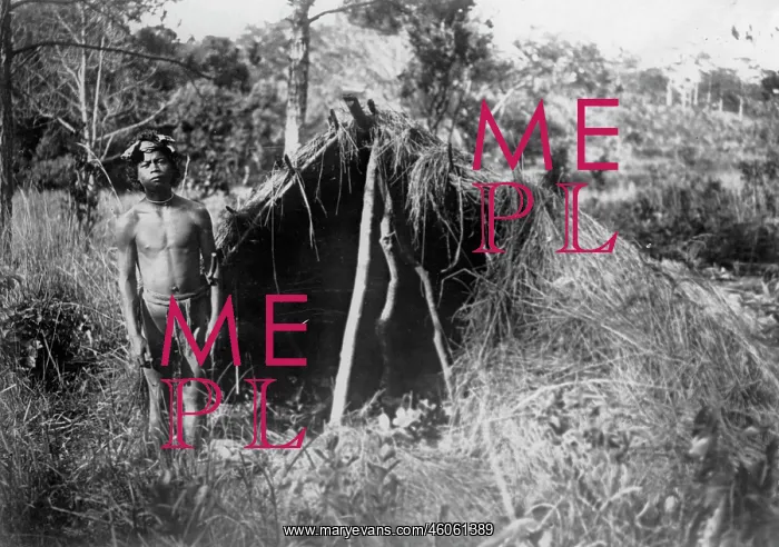: Indigene man with his thatched hut : Indigene man with his thatched hut