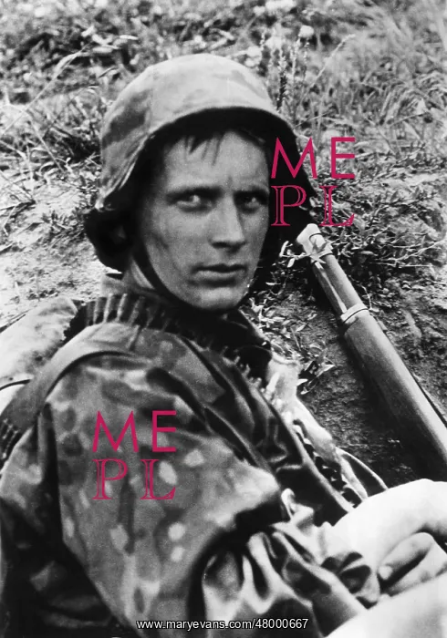 : Infantryman rests in his trench, WW2 : Infantryman rests in his trench, WW2