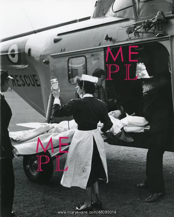 : Injured boy loaded into a Westland Whirlwind : Injured boy loaded into a Westland Whirlwind