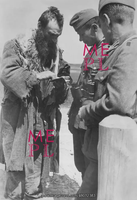 : Inspection of a Jewish man on the Eastern front, 1941 : Inspection of a Jewish man on the Eastern front, 1941