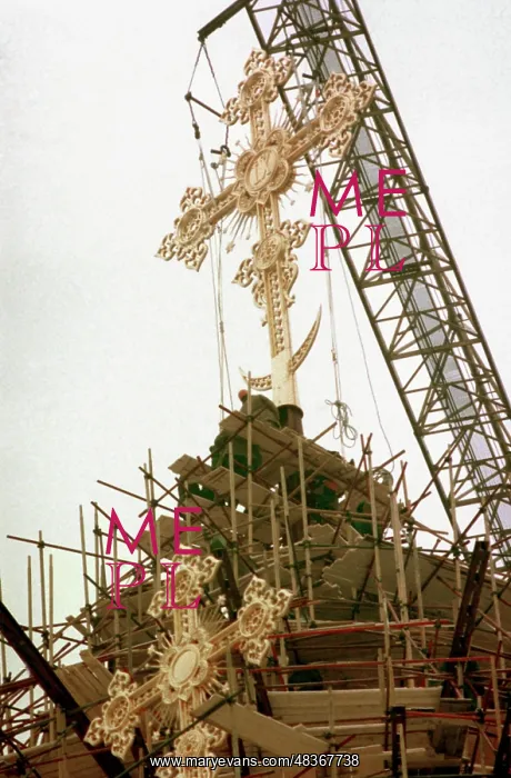 : Installation of golden cross on top of Christ : Installation of golden cross on top of Christ