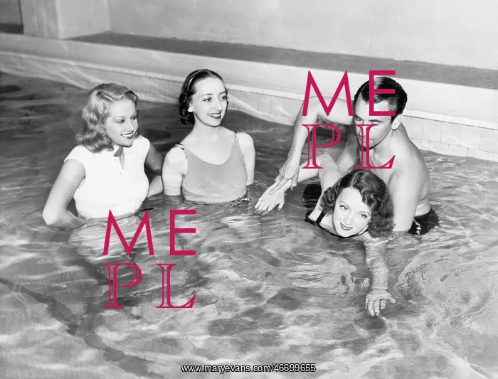 : Instructor teaching women how to swim : Instructor teaching women how to swim