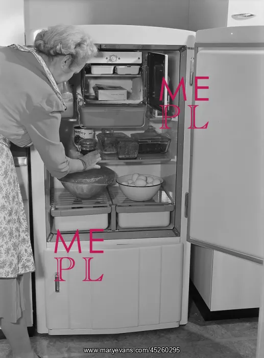 : Interior of a 1940s refrigerator has a small : Interior of a 1940s refrigerator has a small