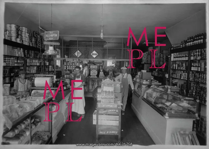 : Interior of a grocery store, with six employees : Interior of a grocery store, with six employees
