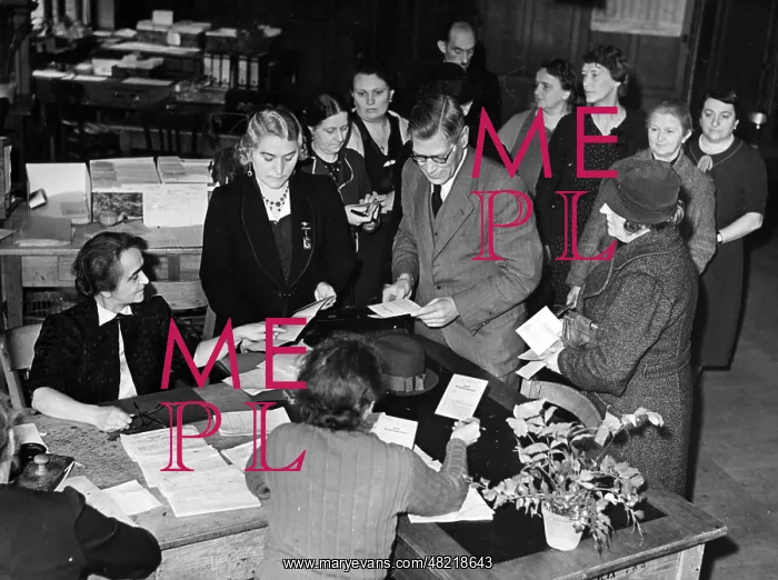 : Issuing cloth coupons in Berlin, 1940 : Issuing cloth coupons in Berlin, 1940