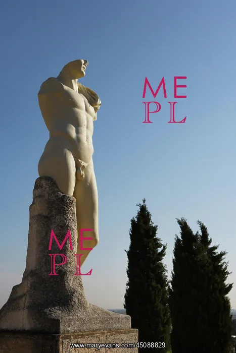: Italica. Low angle view of statue of Emperor Trajan : Italica. Low angle view of statue of Emperor Trajan