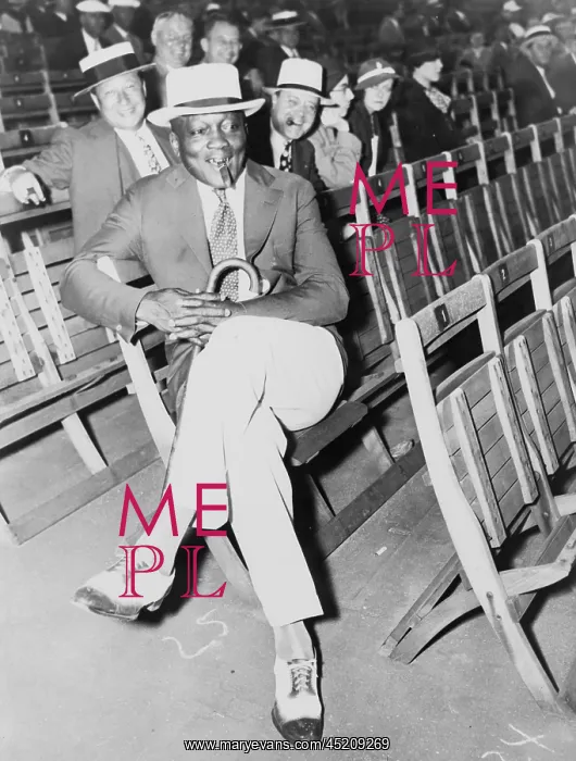: Jack Johnson (1878-1946) smoking a cigar ? : Jack Johnson (1878-1946) smoking a cigar ?