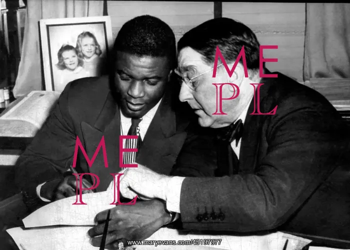 : Jackie Robinson (left), being signed by ? : Jackie Robinson (left), being signed by ?