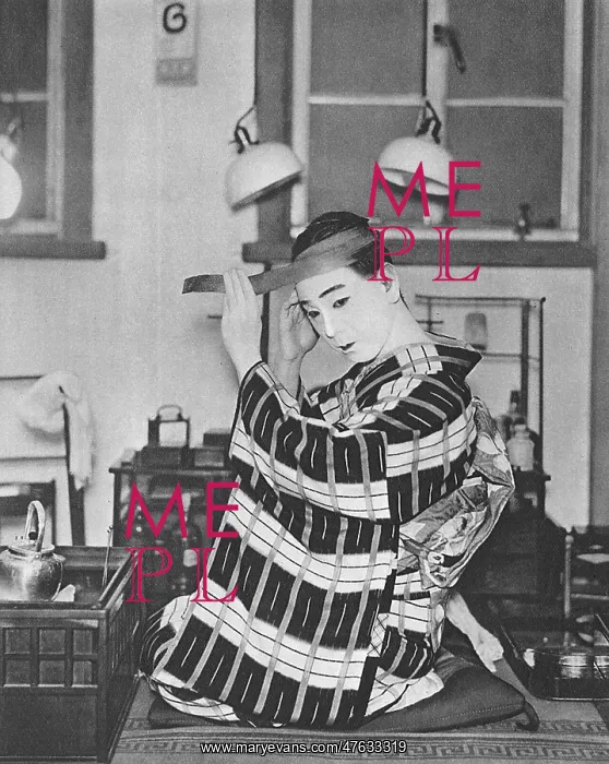 : A Japanese actor dresses : A Japanese actor dresses