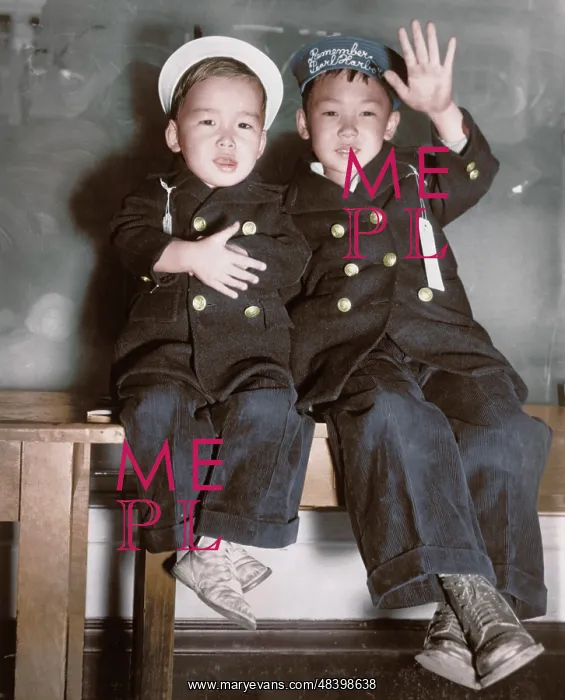 : Two Japanese-American boys wait for a bus : Two Japanese-American boys wait for a bus