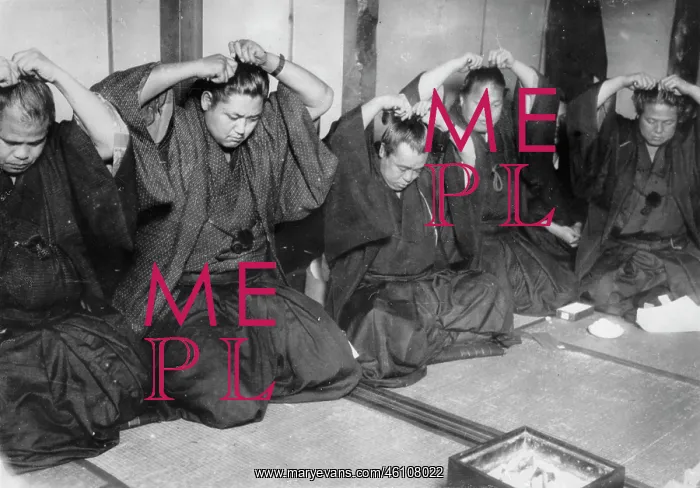 : Japanese sumo wrestler cut off their : Japanese sumo wrestler cut off their