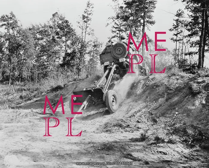 : Jeep pulling a 37mm anti-tank gun across rough : Jeep pulling a 37mm anti-tank gun across rough