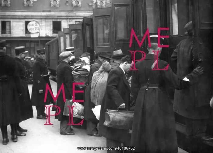 : Jews board a train at a train station in Paris, 1941 : Jews board a train at a train station in Paris, 1941