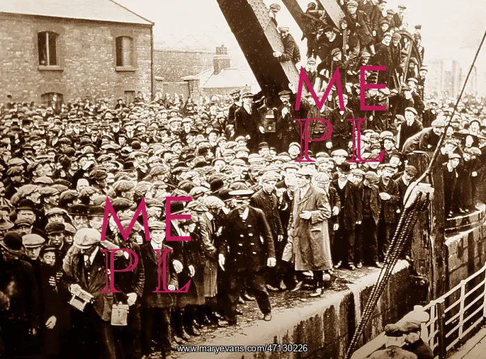 : Jim Larkin walking behind officer on the arrival : Jim Larkin walking behind officer on the arrival