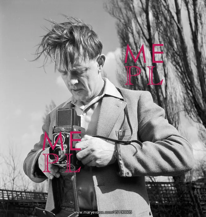  : John Gay. An informal portrait of John Gay outdoors using a twin lens reflex camera