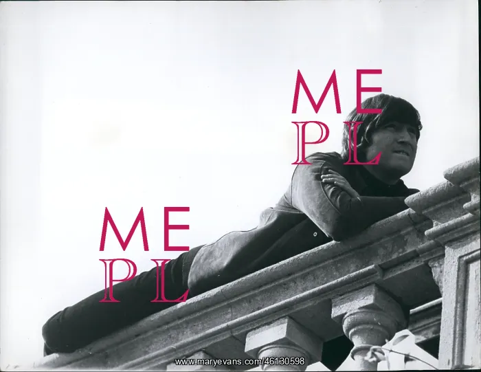 : John Lennon lying on a stone balustrade at stately home : John Lennon lying on a stone balustrade at stately home