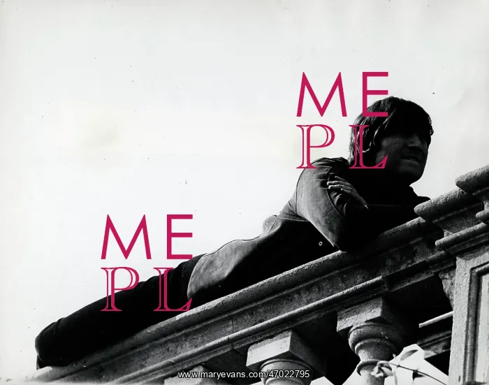 : John Lennon lying on a stone balustrade at stately home : John Lennon lying on a stone balustrade at stately home