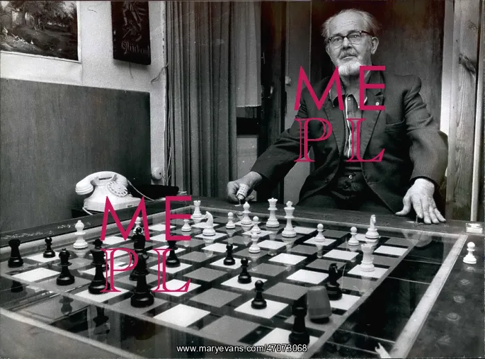 : Josef Stanek with electro-mechanical chess set, Germany : Josef Stanek with electro-mechanical chess set, Germany