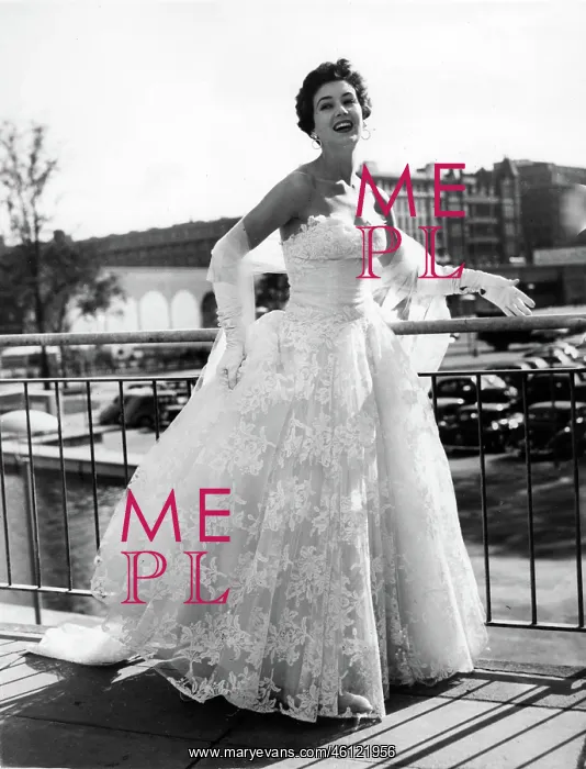 : June Clarke, model, in white evening dress : June Clarke, model, in white evening dress