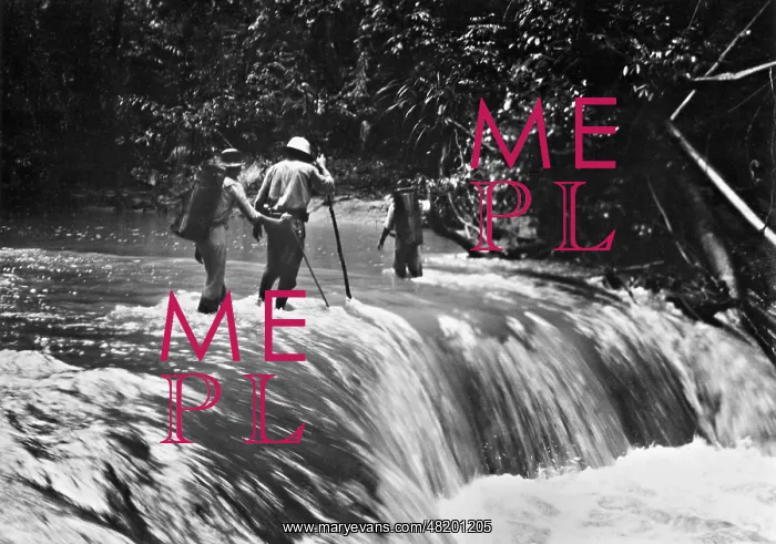 : Jungle explorers crossing a river, 1935 : Jungle explorers crossing a river, 1935