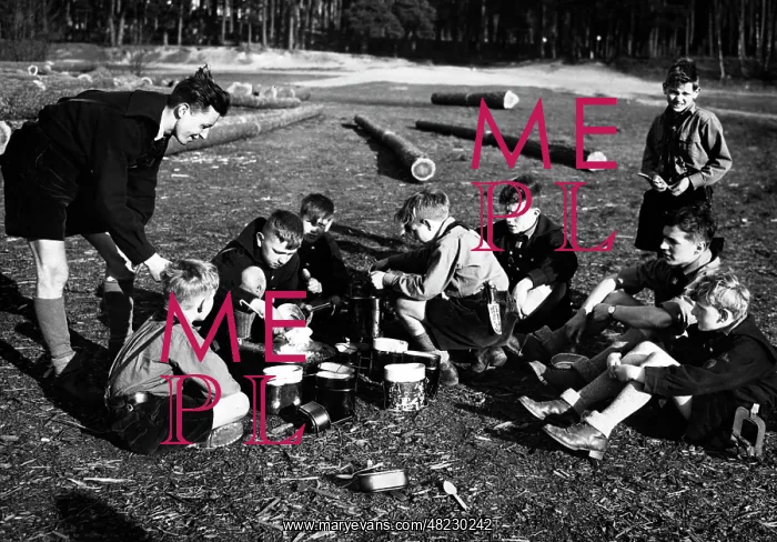 : Jungvolk boys while eating, 1934 : Jungvolk boys while eating, 1934