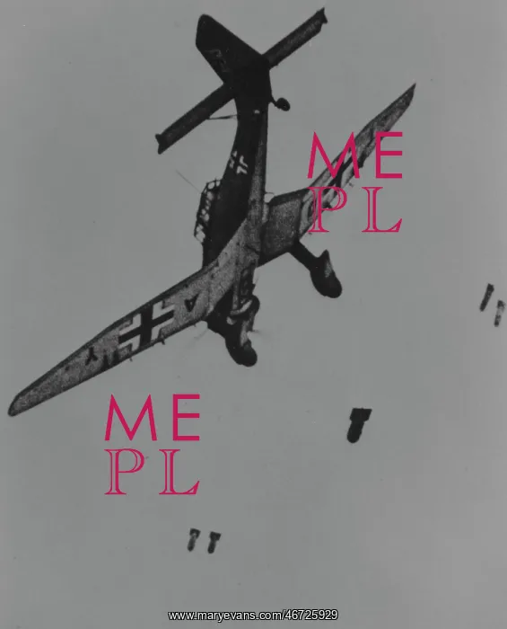 : Junkers Ju 87B -releases its bombs from low level with : Junkers Ju 87B -releases its bombs from low level with