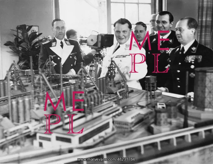 : Karl Bodenschatz and Hermann Goering next to a model of a : Karl Bodenschatz and Hermann Goering next to a model of a