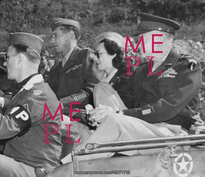 : Kay Summersby seated between Generals Eisenhower : Kay Summersby seated between Generals Eisenhower