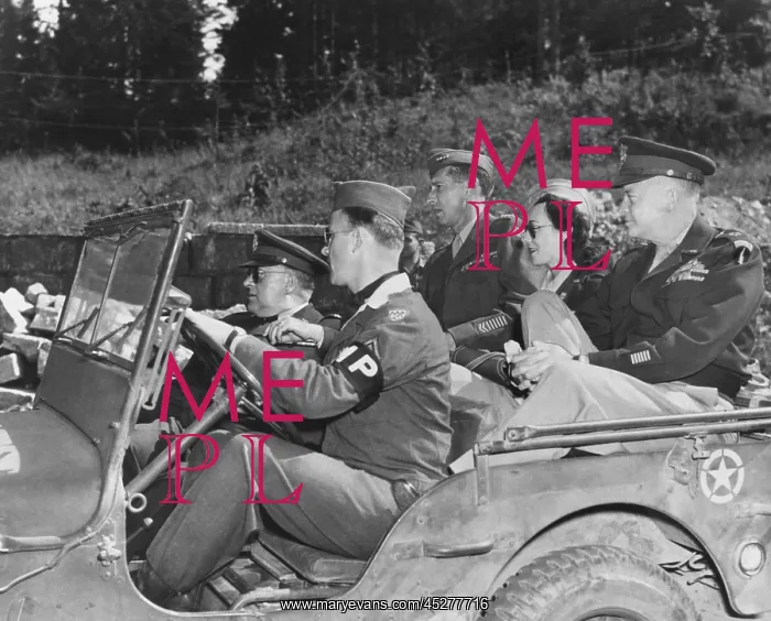 : Kay Summersby seated between Generals Eisenhower : Kay Summersby seated between Generals Eisenhower