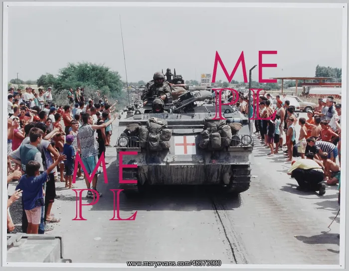 : The KFOR invasion passing Stenkovich refugee camp : The KFOR invasion passing Stenkovich refugee camp
