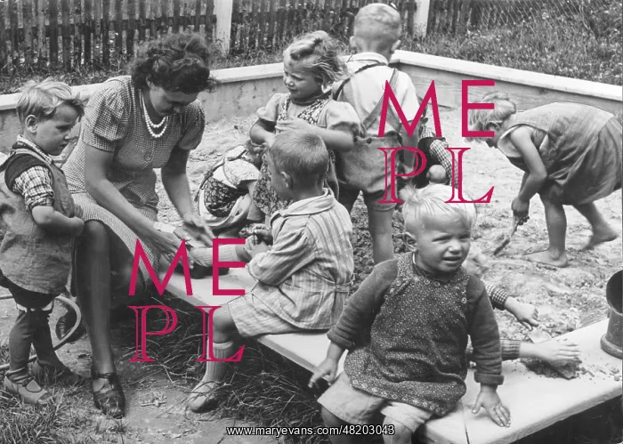 : Kindergarten teacher with children, 1940 : Kindergarten teacher with children, 1940
