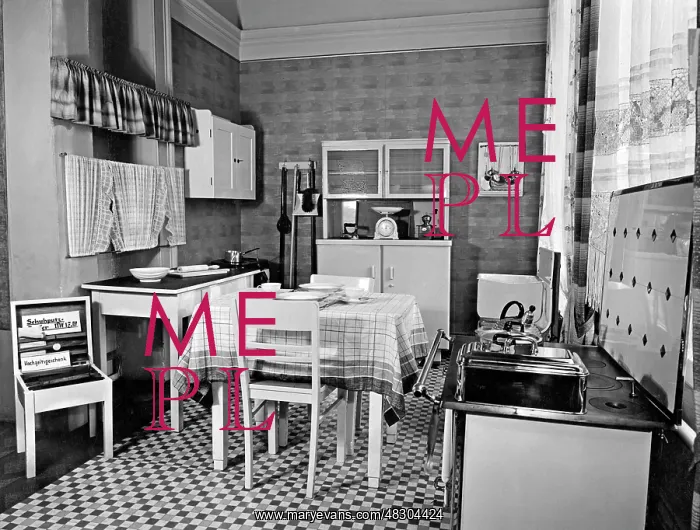 : Kitchen with dining table, stove, sideboard and cabinet (undated picture) : Kitchen with dining table, stove, sideboard and cabinet (undated picture)