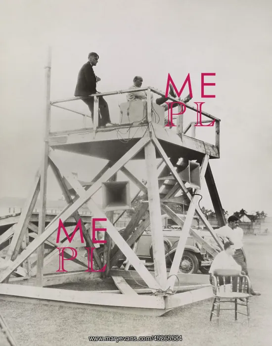 : Knute Rockne, seated on coaching tower : Knute Rockne, seated on coaching tower