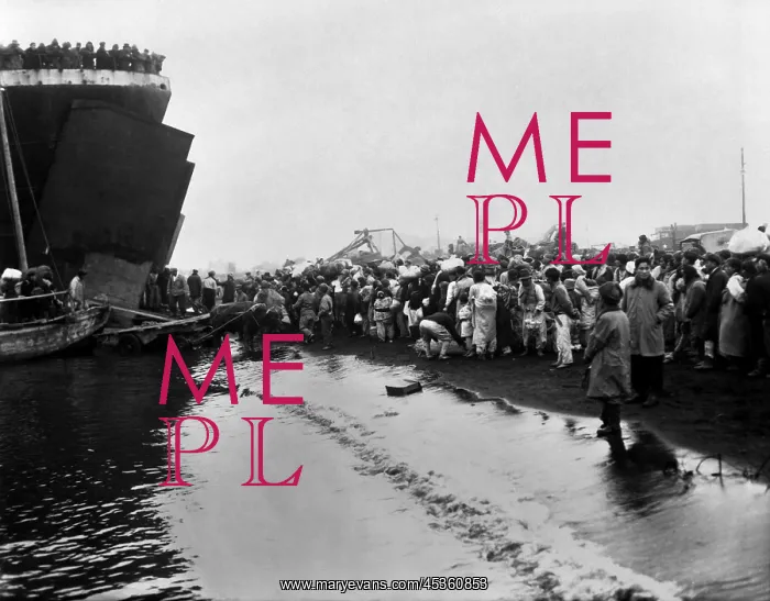 : Korean refugees prepare to board an LST during the : Korean refugees prepare to board an LST during the