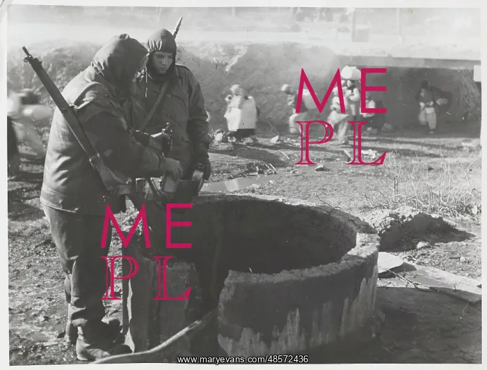 : Korean War - two soldiers at well : Korean War - two soldiers at well