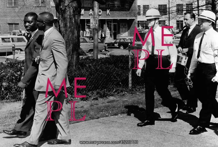 : A Ku Klux Klan Security Patrol walk behind ? : A Ku Klux Klan Security Patrol walk behind ?
