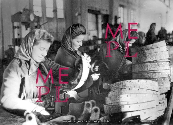 : Laborers (Eastern female workers) in a repair station for mo : Laborers (Eastern female workers) in a repair station for mo