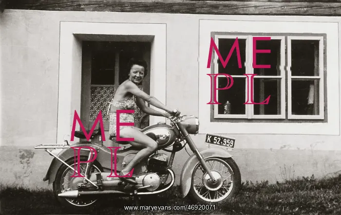 : Lady on a 1958 / 9 Puch motorcycle : Lady on a 1958 / 9 Puch motorcycle