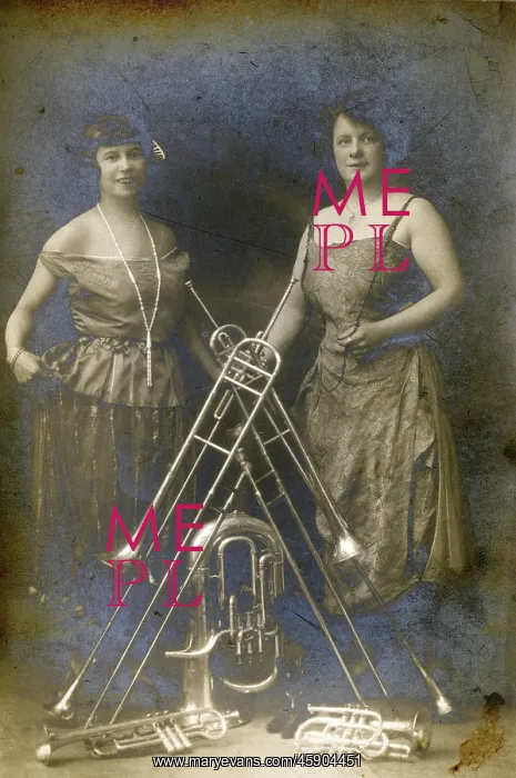 : Two Lady Brass Musicians and a variety of their instruments : Two Lady Brass Musicians and a variety of their instruments