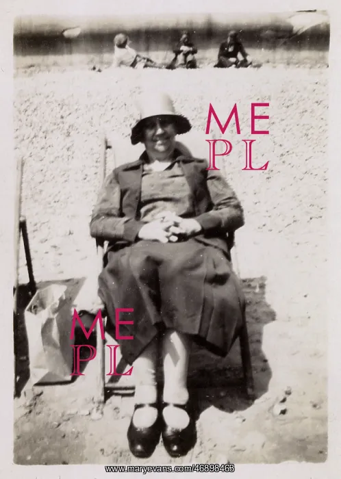 : Lady in a deckchair on the beach : Lady in a deckchair on the beach