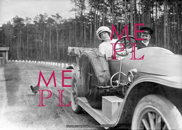 : Lady is driving a convertible : Lady is driving a convertible