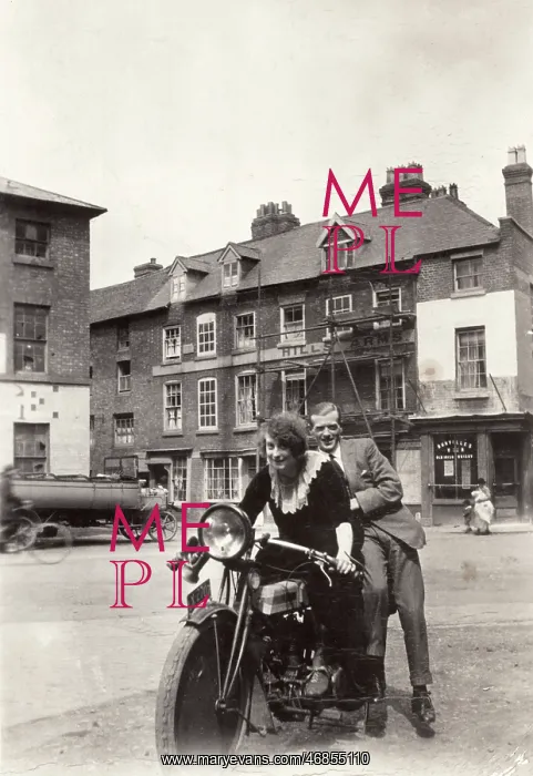 : Lady & gentleman on a 1920 Triumph motorcycle : Lady & gentleman on a 1920 Triumph motorcycle