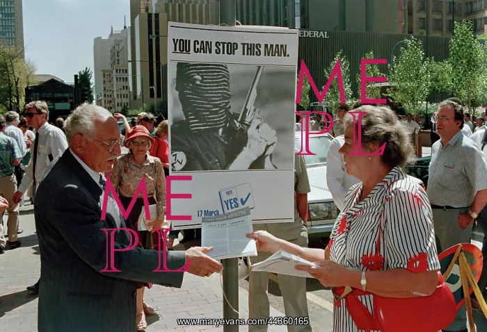 : Lady hands out white right wing propaganda : Lady hands out white right wing propaganda