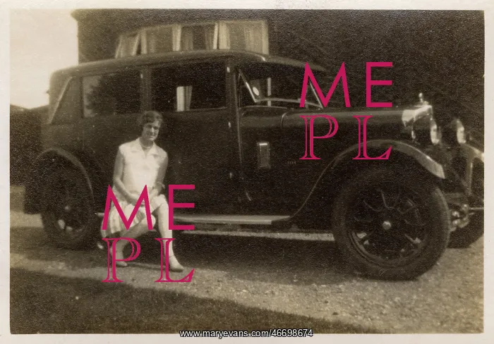 : A lady ('Marion') - sitting on the running board of her car : A lady ('Marion') - sitting on the running board of her car