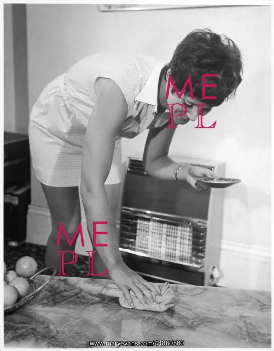  : LADY POLISHES A TABLE