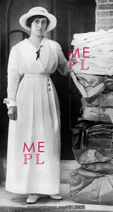 : Lady Quilter with pile of comforts for troops, WW1 : Lady Quilter with pile of comforts for troops, WW1