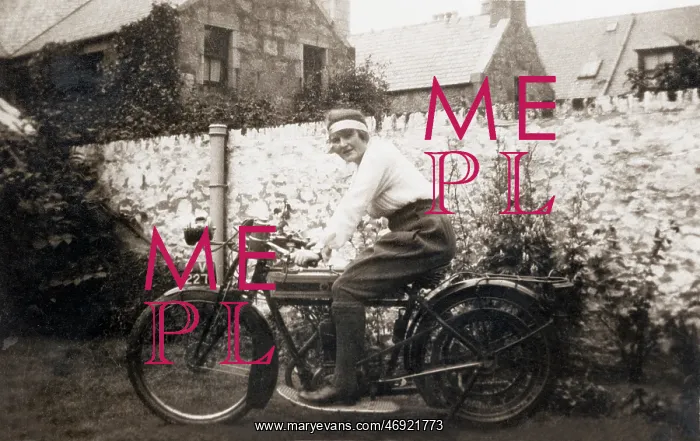 : Lady sitting on 1918 Triumph motorcycle : Lady sitting on 1918 Triumph motorcycle