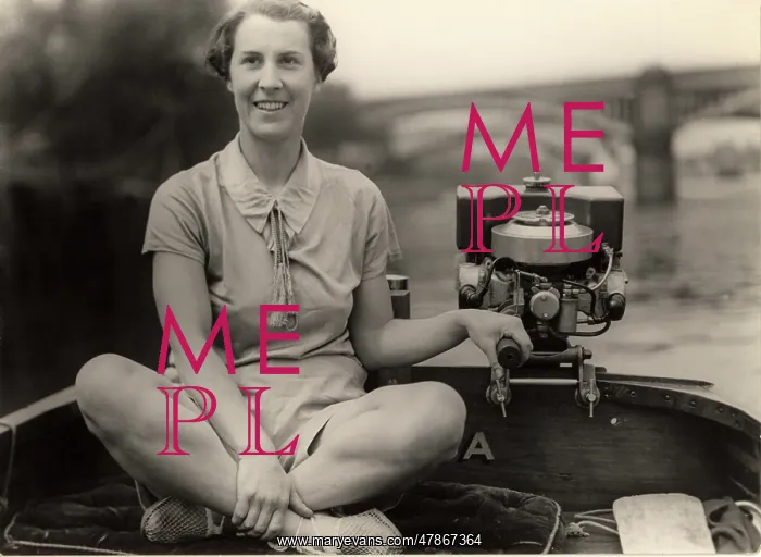 : Lady steering boat : Lady steering boat