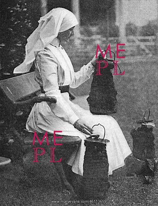 : Lady Stradbroke posed with bombs dropped on Henham Hall, WW1 : Lady Stradbroke posed with bombs dropped on Henham Hall, WW1